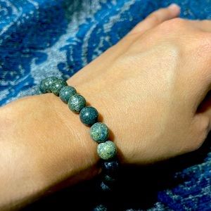 Brand new gray and black bracelet with silver bead.